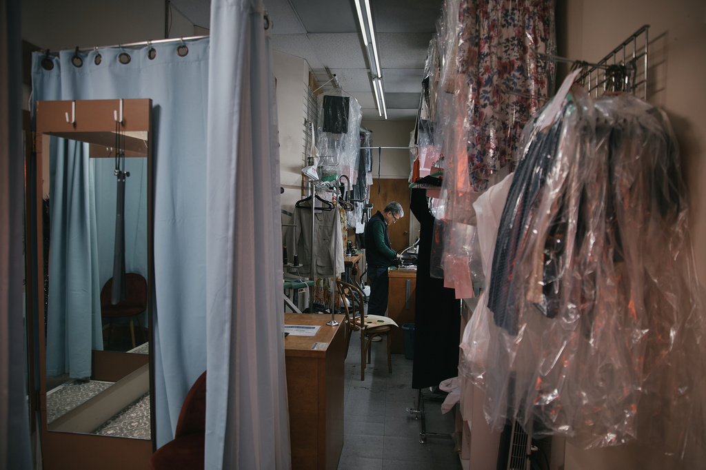 Tailor, Kil Bae, works inside his shop on Friday, March 27, 2026, in New York. (AP Photo/Andres Kudacki)