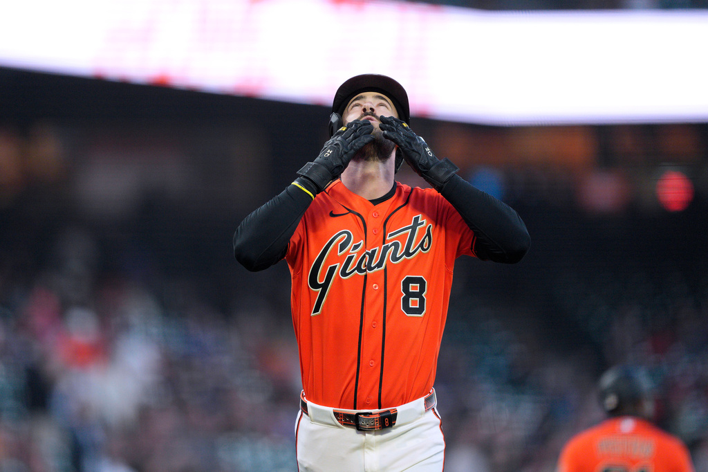 San Francisco Giants' Bryce Eldridge gestures as he crosses home plate after hitting a home run against the Arizona Diamondbacks during the first inning of a baseball game in San Francisco, Friday, Aug. 28, 2026. (AP Photo/Tony Avelar)