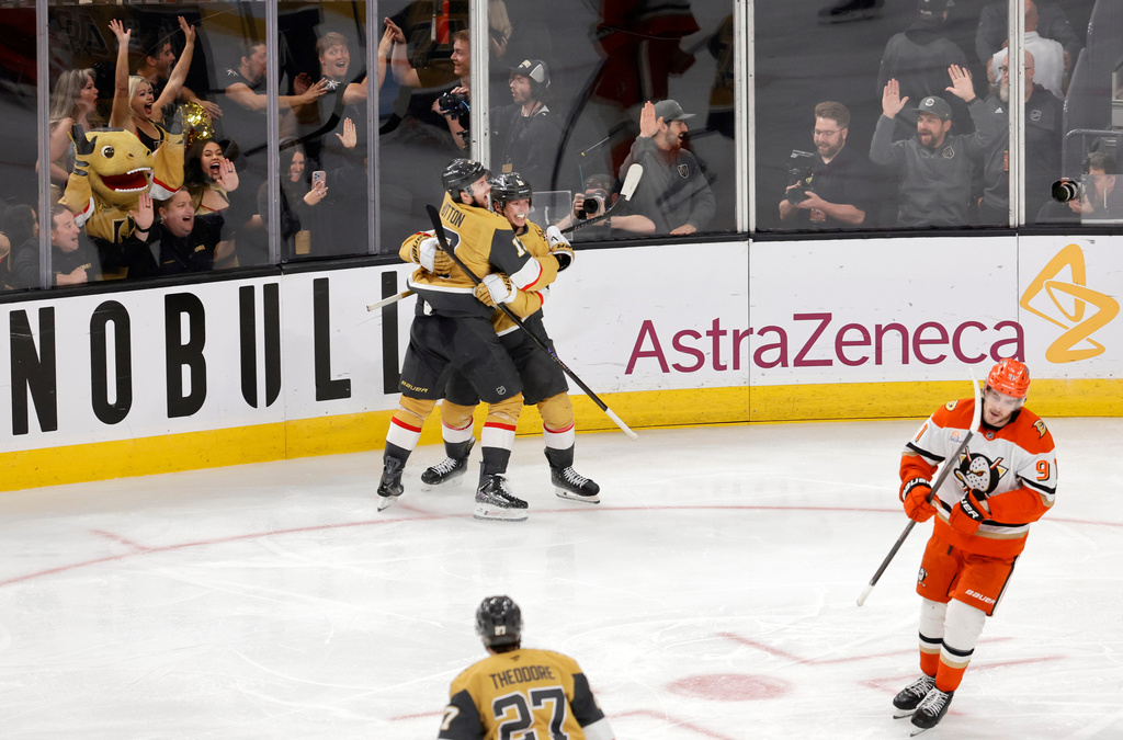 Vegas Golden Knights right wing Pavel Dorofeyev, center right, celebrates with Vegas Golden Knights defenseman Ben Hutton (17) after scoring against the Anaheim Ducks in overtime of Game 5 of a second-round NHL hockey Stanley Cup playoff series Tuesday, May 12, 2026, in Las Vegas. (Steve Marcus/Las Vegas Sun via AP)