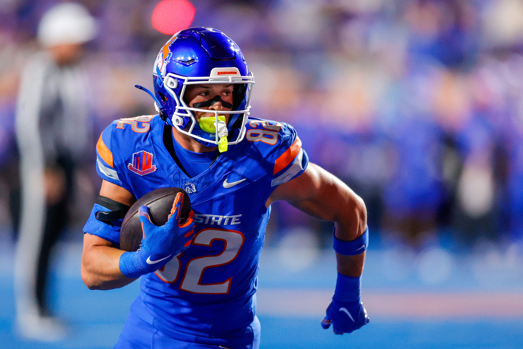 Boise State wide receiver Ben Ford (82) turns up field on a touchdown reception against New Mexico in the first half of an NCAA college football game, Saturday, Oct. 11, 2025, in Boise, Idaho. (AP Photo/Steve Conner)