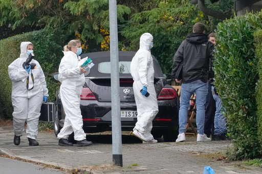 Forensic investigators appear at the crime scene at a street in Herdecke, Germany, Tuesday, Oct. 7, 2025, after the newly elected mayor of Herdecke, Iris Stalzer, has been found critically injured in her apartment. (AP Photo/Martin Meissner) Forensic investigators appear at the crime scene at a street in Herdecke, Germany, Tuesday, Oct. 7, 2025, after the newly elected mayor of Herdecke, Iris Stalzer, has been found critically injured in her apartment. (AP Photo/Martin Meissner)