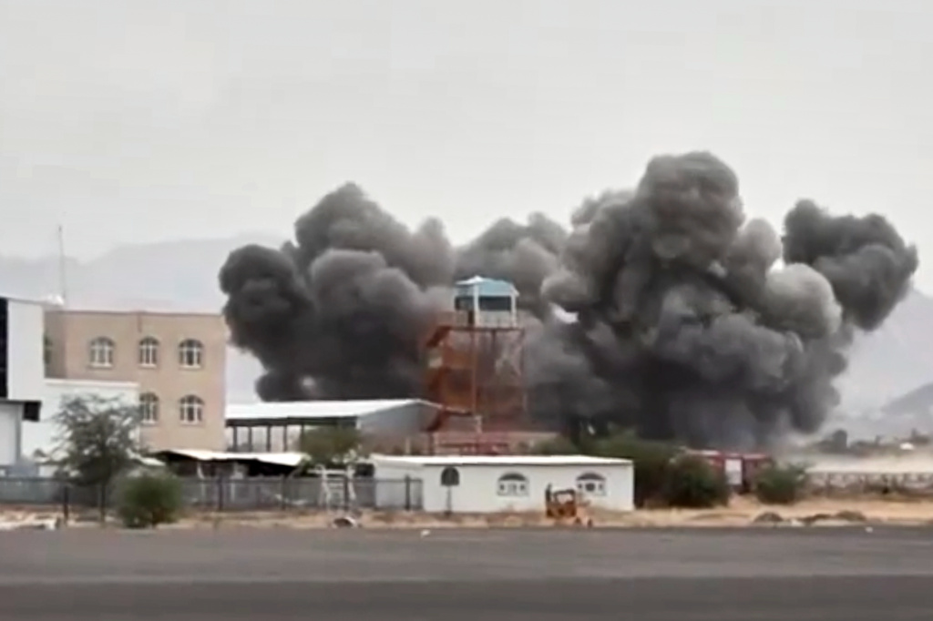 FILE - This image taken from video broadcast by Al-Masirah TV, a Houthi-controlled news channel, shows an explosion at the Sanaa International Airport compound during what the Iranian-backed Houthi rebels in Yemen said were several Saudi airstrikes in Sanaa, Yemen, July 13, 2026. (Al-Masirah TV via AP, File)