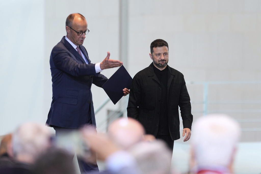 FILE -Germany's Chancellor Friedrich Merz, left, and Ukraine's President Volodymyr Zelenskyy arrive for a news conference at the chancellery in Berlin, Germany, May 28, 2025.(AP Photo/Markus Schreiber, File)