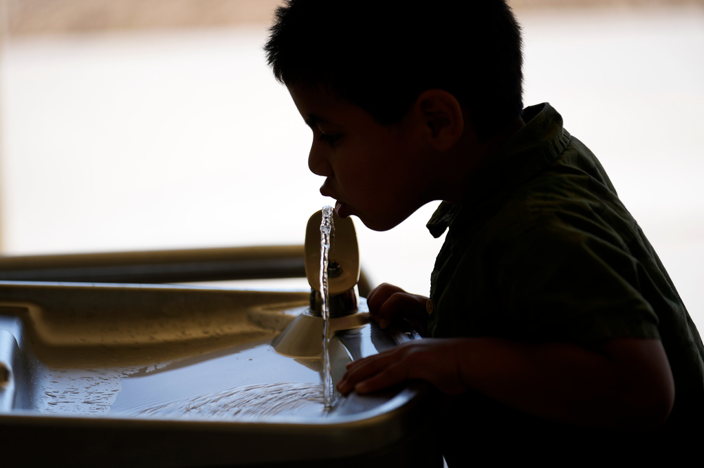 FILE - A student drinks from a water fountain inside Cuyama Elementary School, Sept. 20, 2023, in New Cuyama, Calif. (AP Photo/Marcio Jose Sanchez, file)