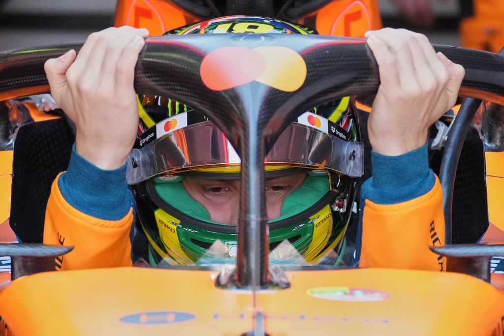 McLaren driver Oscar Piastri of Australia gets into his car for the first practice session for the Australian Formula One Grand Prix at Albert Park, in Melbourne, Australia, Friday, March 6, 2026. (AP Photo/Asanka Brendon Ratnayake)