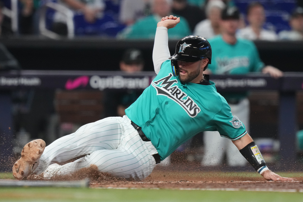 Miami Marlins' Joe Mack scores on a single hit by Javier Sanoja during the fifth inning of a baseball game against the Los Angeles Angels, Sunday, Aug. 9, 2026, in Miami. (AP Photo/Lynne Sladky)
