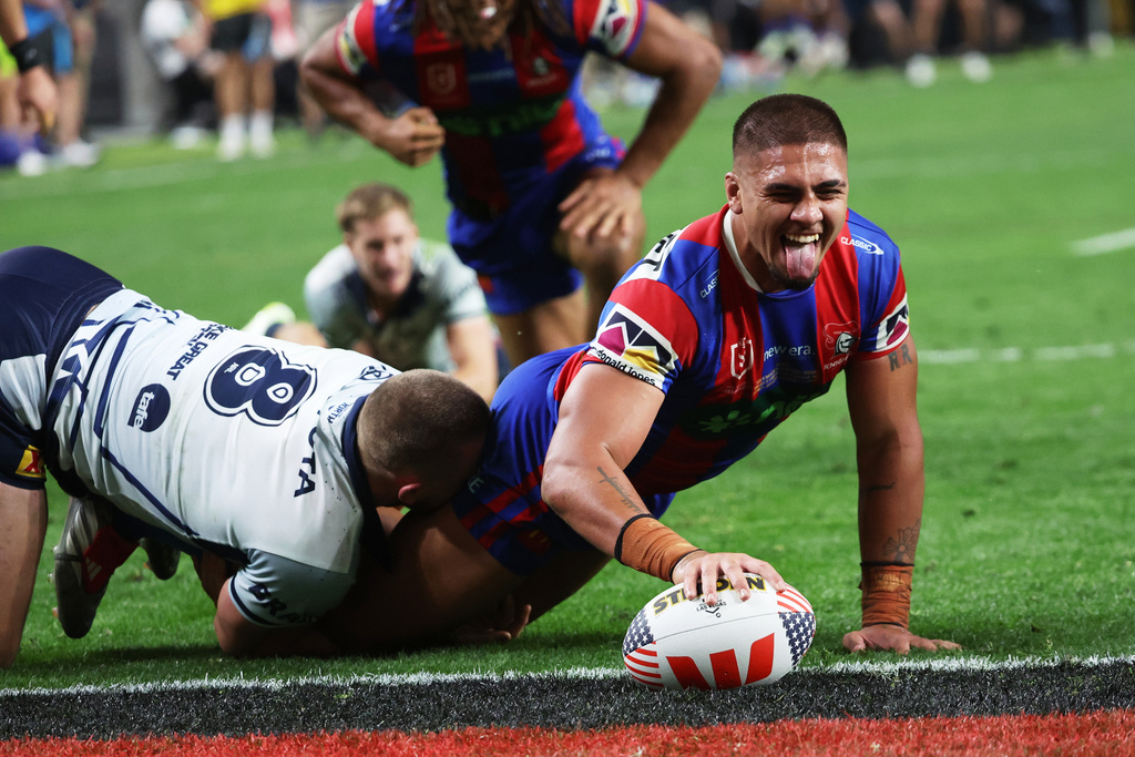 Newcastle Knights Trey Mooney reacts after scoring a try during the Australia National Rugby League game between Newcastle Knights and the North Queensland Cowboys in Las Vegas, Saturday, Feb. 28, 2026. (AP Photo/Ian Maule)