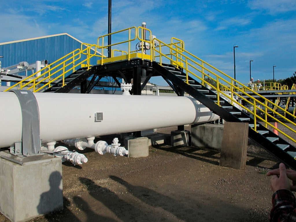 FILE - An above ground section of Enbridge's Line 5 at the Mackinaw City, Mich., pump station on Oct. 7, 2016. (AP Photo/John Flesher, File)
