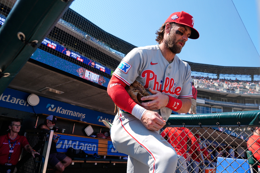 Philadelphia Phillies first baseman Bryce Harper heads to the field against the Detroit Tigers during the ninth inning Sunday, July 12, 2026, in Detroit. (AP Photo/Paul Sancya)