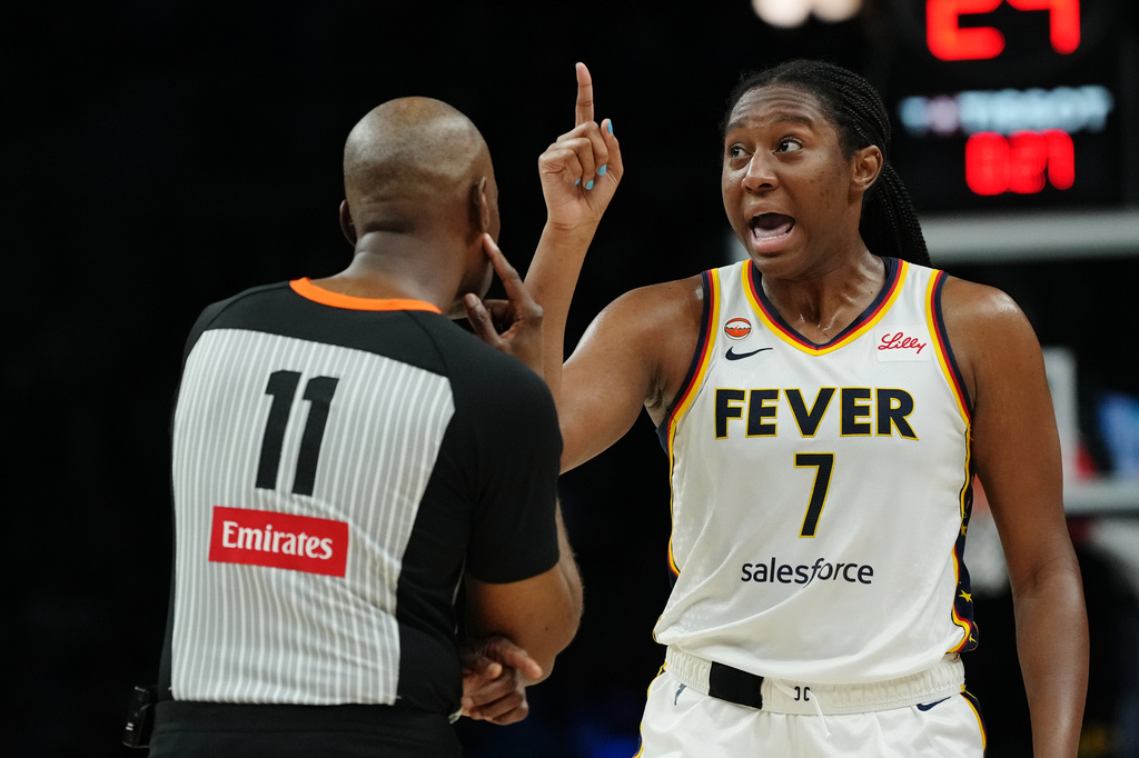 Indiana Fever center-forward Aliyah Boston (7) argues with a referee (11) during the first half of a WNBA basketball game against the Minnesota Lynx, Thursday, Sept. 24, 2026, in Minneapolis. (AP Photo/Ellen Schmidt)