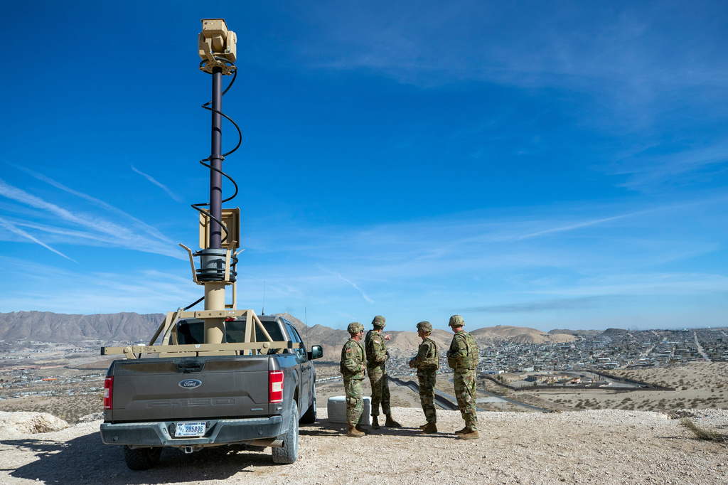 FILE - Army soldiers look at the border wall next to a surveillance vehicle during the visit to the U.S. and Mexico border by Defense Secretary Pete Hegseth in Sunland Park, N.M., Feb. 3, 2025. (AP Photo/Andres Leighton, File)