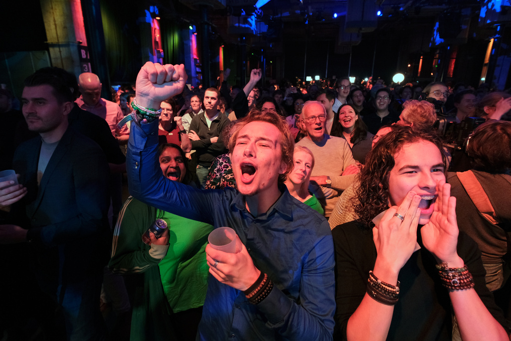 People react during early exit poll results for the PvdA party at an election venue during a general election in Rotterdam, Netherlands, Wednesday, Oct. 29, 2025. (AP Photo/Patrick Post)
