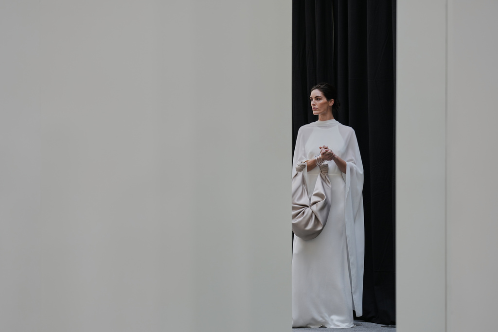 A model wears a design by Silvia Tcherassi backstage before the brand's show at Fashion Week in Madrid, Spain, Wednesday, Sept. 17, 2025. (AP Photo/Manu Fernandez)