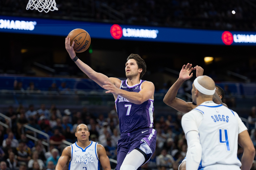 Sacramento Kings forward Doug McDermott (7) lays the ball up during the first half of an NBA basketball game, against the Orlando Magic, Thursday, March 26, 2026, in Orlando, Fla. (AP Photo/Willie J. Allen Jr.)