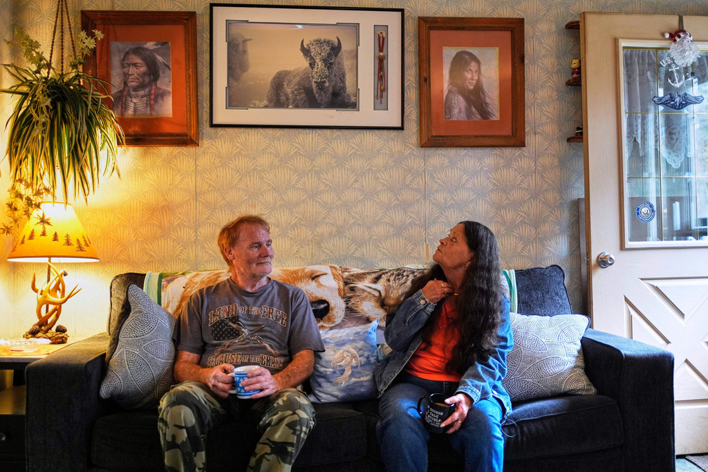Susan Bushby, right, a patient at Ammonoosuc Community Health Services, and her son, Steven, sit in their home, Tuesday, Oct. 21, 2025, in Lisbon, N.H. (AP Photo/Robert F. Bukaty)
