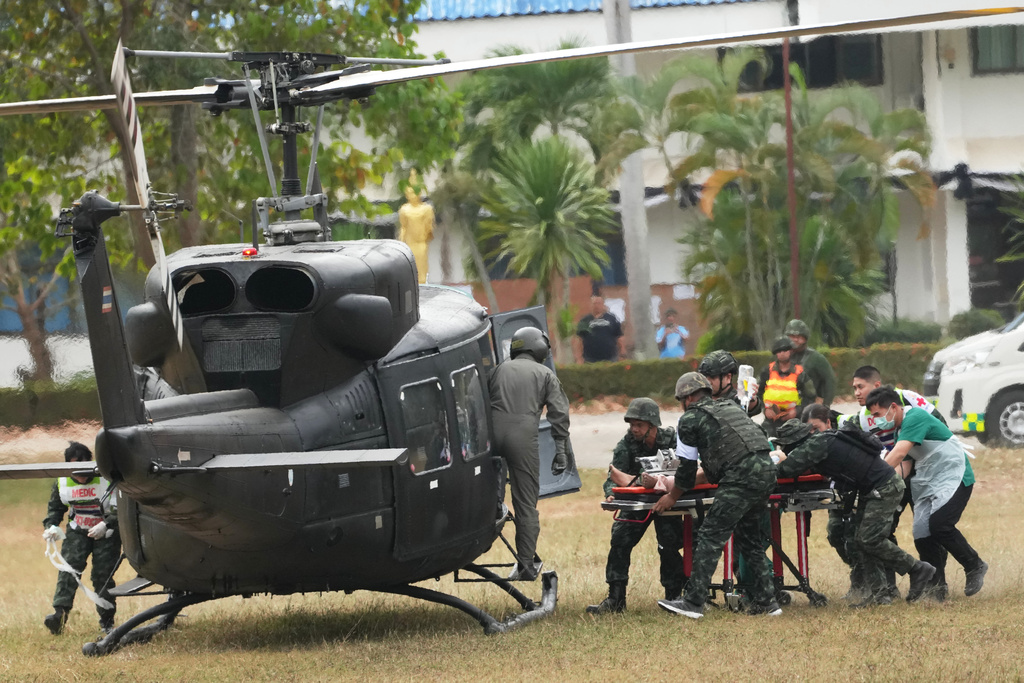 An wounded Thai soldier is carried to be transferred to a hospital, in Surin province, Thailand, Wednesday, Dec. 10, 2025, following clashes between Thai and Cambodian soldiers. (AP Photo/Sakchai Lalit)