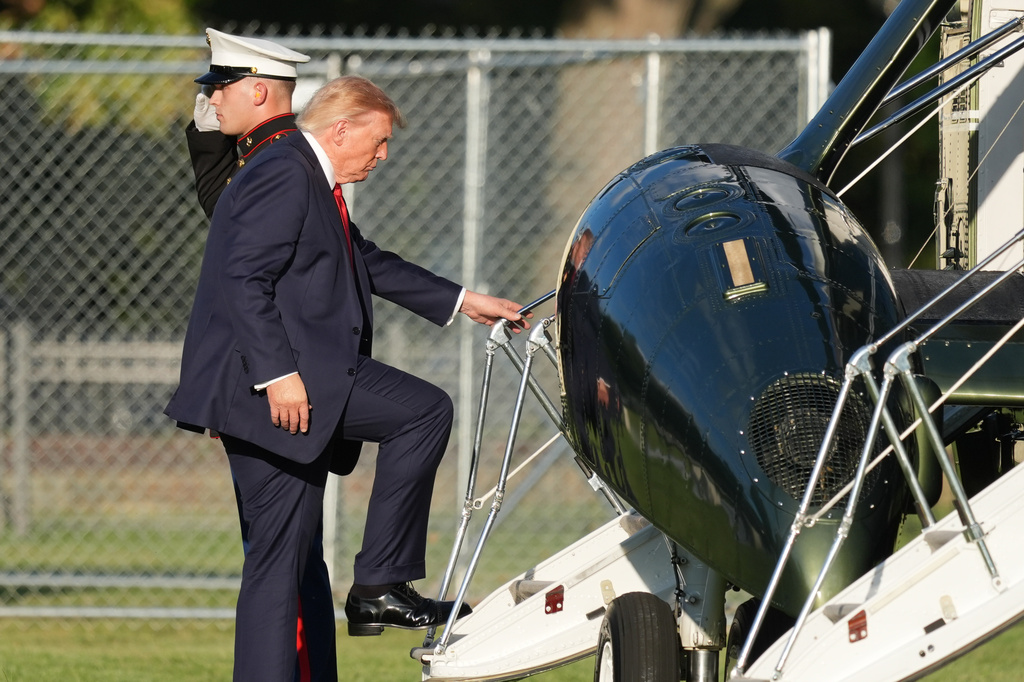 President Donald Trump boards Marine One on the Ellipse near the White House, Friday, Sept. 18, 2026, in Washington. (AP Photo/Alex Brandon)