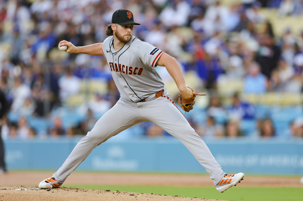 San Francisco Giants starting pitcher Landen Roupp throws during the first inning of a baseball game against the Los Angeles Dodgers, Thursday, May 14, 2026, in Los Angeles. (AP Photo/Ryan Sun)