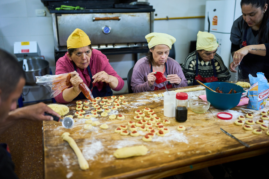 Residents participate in a pastry workshop at the Pequeño Cottolengo Don Orione, a home for people with disabilities that will be visited by Pope Leo XIV in November, in Buenos Aires, Argentina, Thursday, Sept. 24, 2026. (AP Photo/Rodrigo Abd)