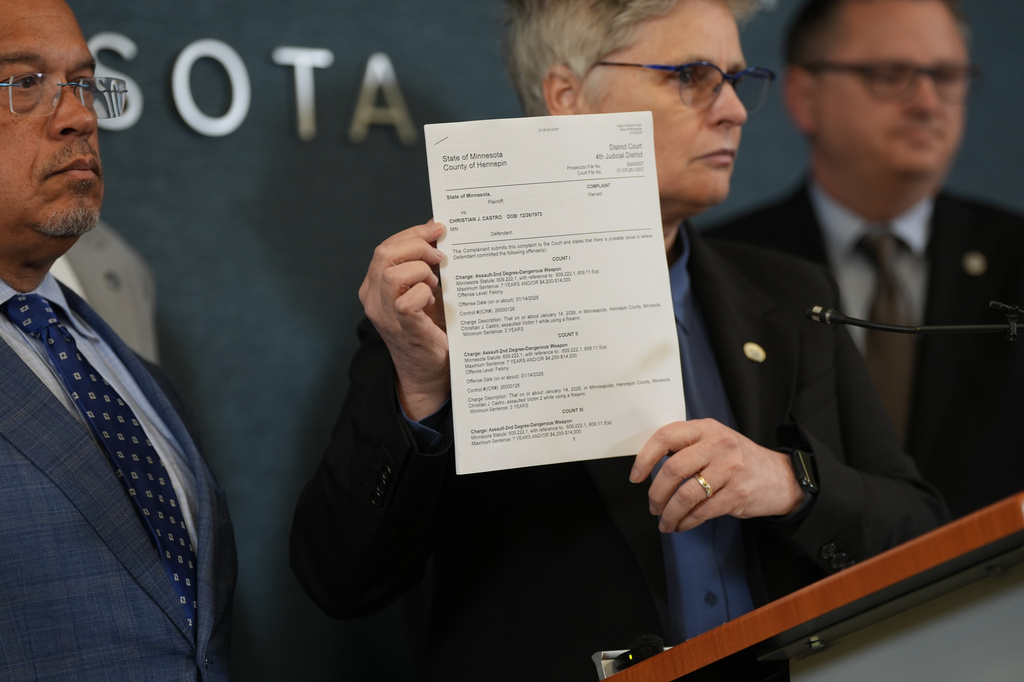 Hennepin County attorney Mary Moriarty holds up a document containing charges against ICE agent Christian Castro during a news conference at the Hennepin County Government Center in Minneapolis, on Monday, May 18, 2026. (Renée Jones Schneider/Minnesota Star Tribune via AP)
