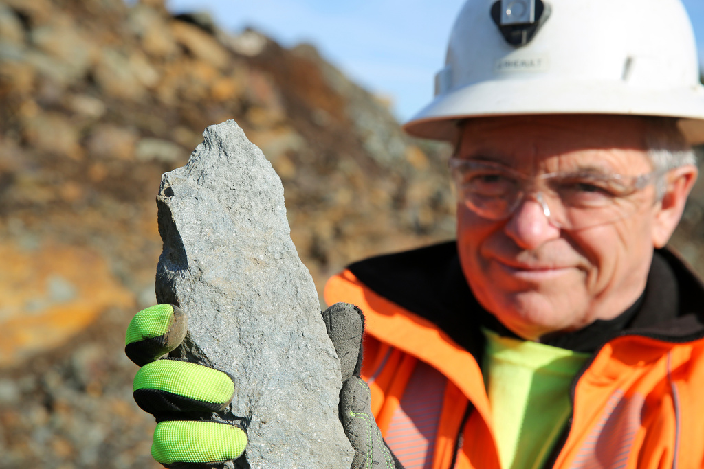 Joel Rheault, vice president of operations for Titan Mining Corp., holds a rock containing graphite at a mine, Nov. 20, 2025, in Gouverneur, N.Y. (AP Photo/Michael Hill)