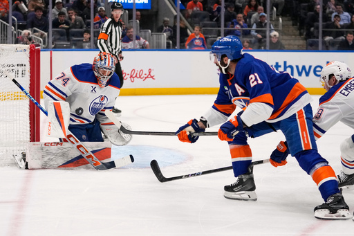 Edmonton Oilers goaltender Stuart Skinner (74) stops a shot by New York Islanders' Kyle Palmieri (21) during the second period of an NHL hockey game Thursday, Oct. 16, 2025, in Elmont, N.Y. (AP Photo/Frank Franklin II) Edmonton Oilers goaltender Stuart Skinner (74) stops a shot by New York Islanders' Kyle Palmieri (21) during the second period of an NHL hockey game Thursday, Oct. 16, 2025, in Elmont, N.Y. (AP Photo/Frank Franklin II)