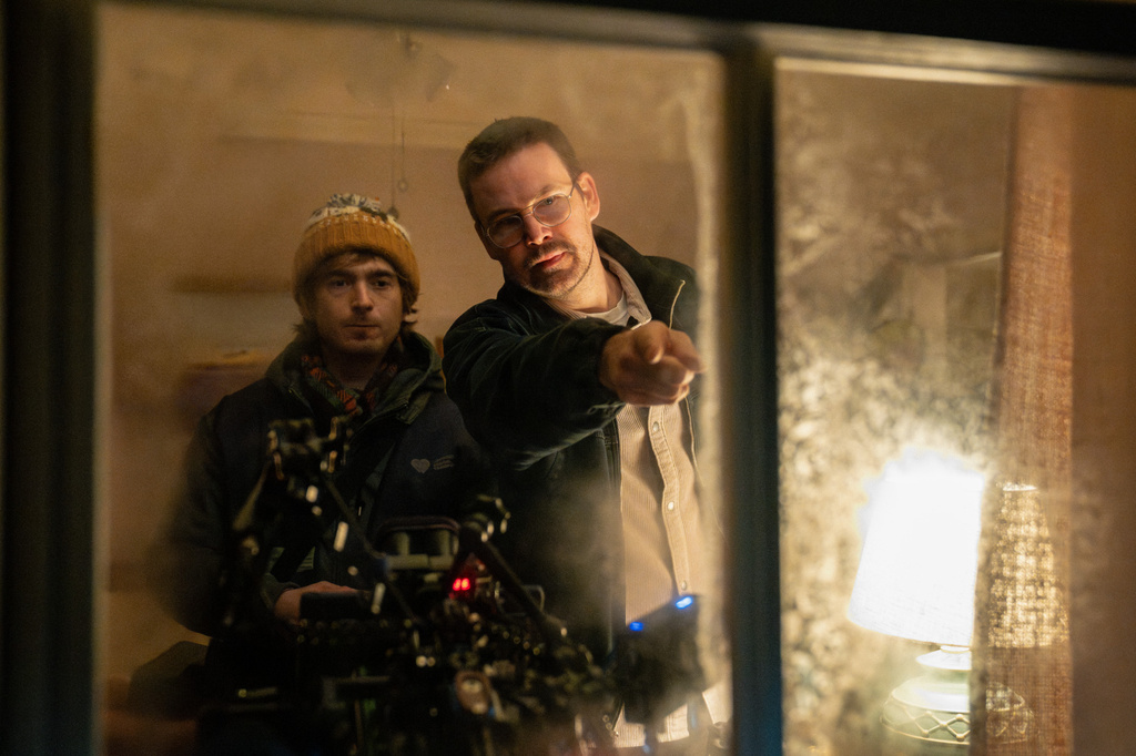 This image released by Sony Pictures shows Austin Abrams, left, with director Zach Cregger on the set of "Resident Evil." (Sony Pictures via AP)