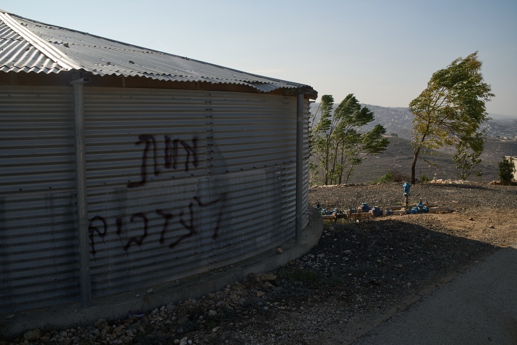 A piece of graffiti reads in Hebrew, "Death to Arabs," following an attack by Israeli settlers in the West Bank village of al-Jab'a, near Bethlehem, Tuesday, Nov. 18, 2025. (AP Photo/Leo Correa)