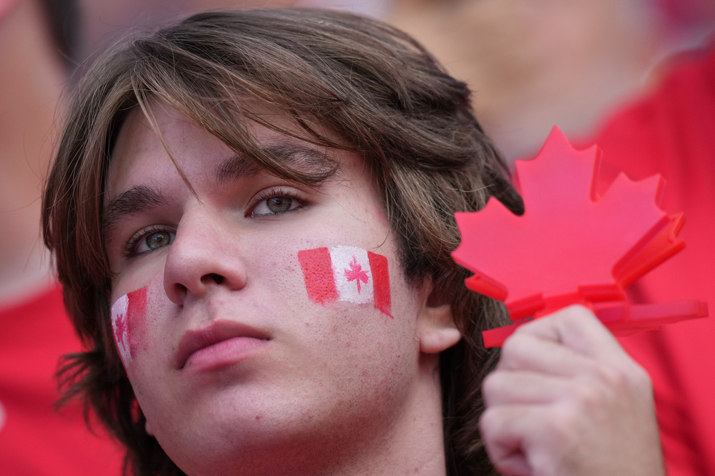 A Canadian fan sits in the stands as he waits for the start of the World Cup Group B soccer match between Canada and Bosnia in Toronto, Friday, June 12, 2026. (AP Photo/Stephanie Scarbrough)