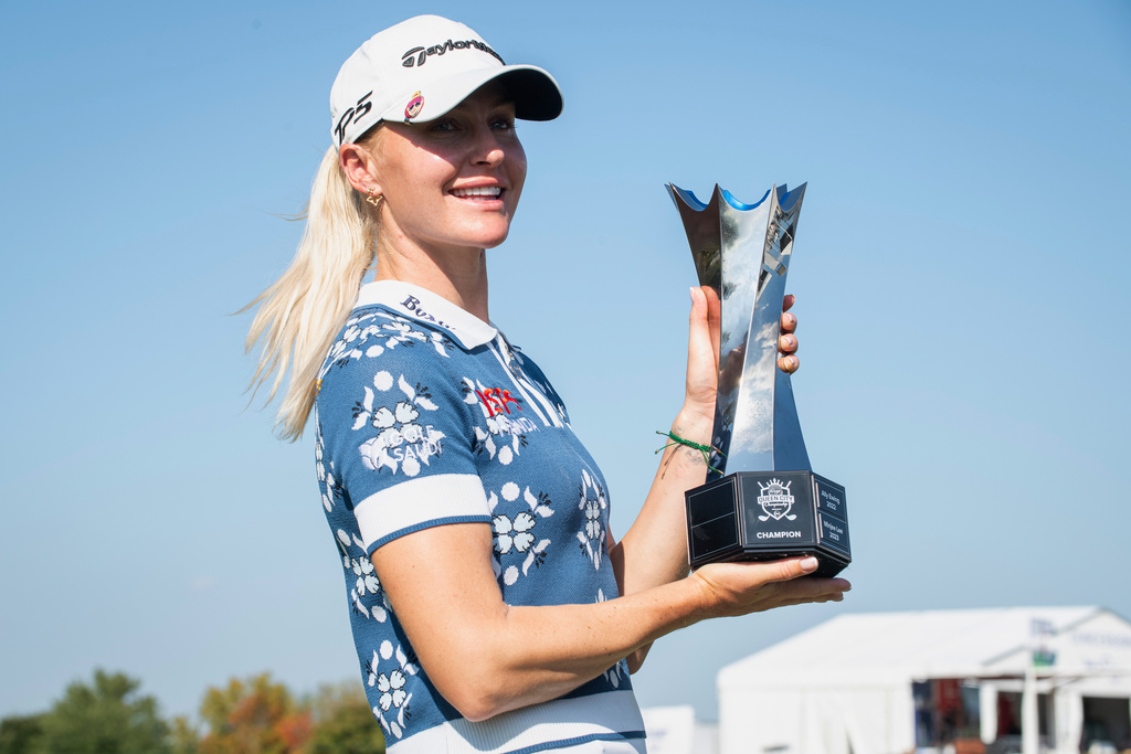 Charley Hull, of England, holds the trophy after winning the Kroger Queen City Championship golf tournament, Sunday, Sept. 14, 2025, at TPC River's Bend in Cincinnati. (AP Photo/Tanner Pearson)
