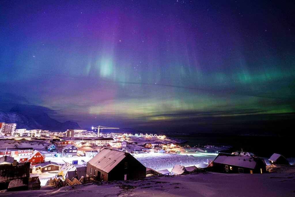 Aurora borealis, also known as the northern lights, is seen in the sky above Nuuk, Greenland, Tuesday, Jan. 20, 2026. (AP Photo/Evgeniy Maloletka)