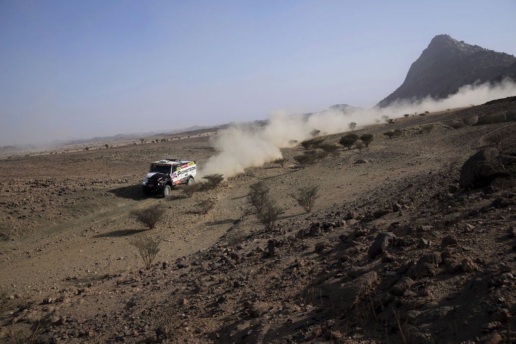 Truck driver Martin Macik, co-drivers David Svanda and Frantisek Tomasek compete during the prologue of the Dakar Rally in Bisha, Saudi Arabia, Friday, Jan. 3, 2025. (AP Photo/Christophe Ena)