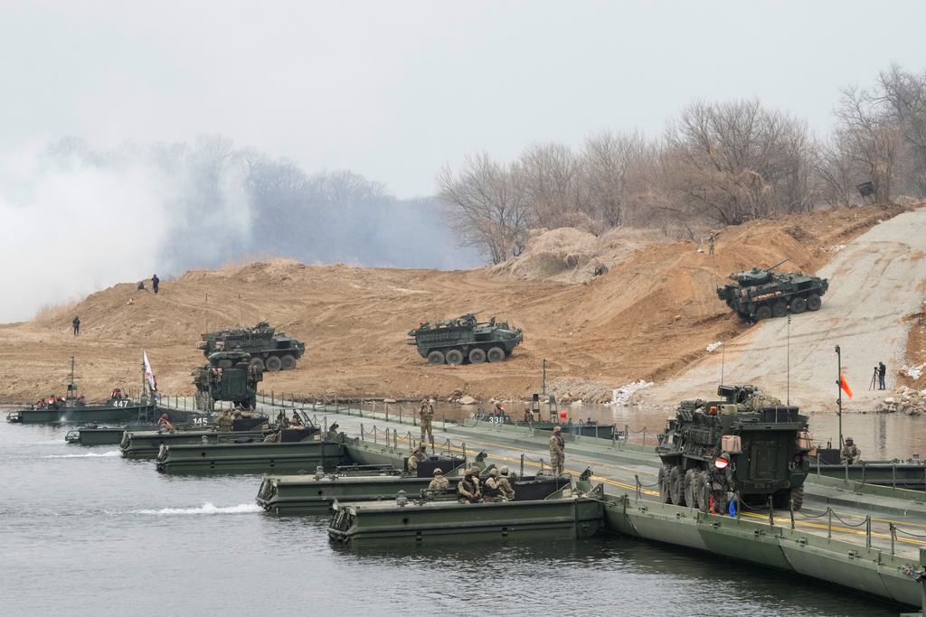 U.S. Army's armored vehicles cross a floating bridge on the Imjin River during a joint river-crossing exercise between South Korea and the United States as a part of the Freedom Shield military exercise in Yeoncheon, South Korea, Saturday, March 14, 2026. (AP Photo/Ahn Young-joon)