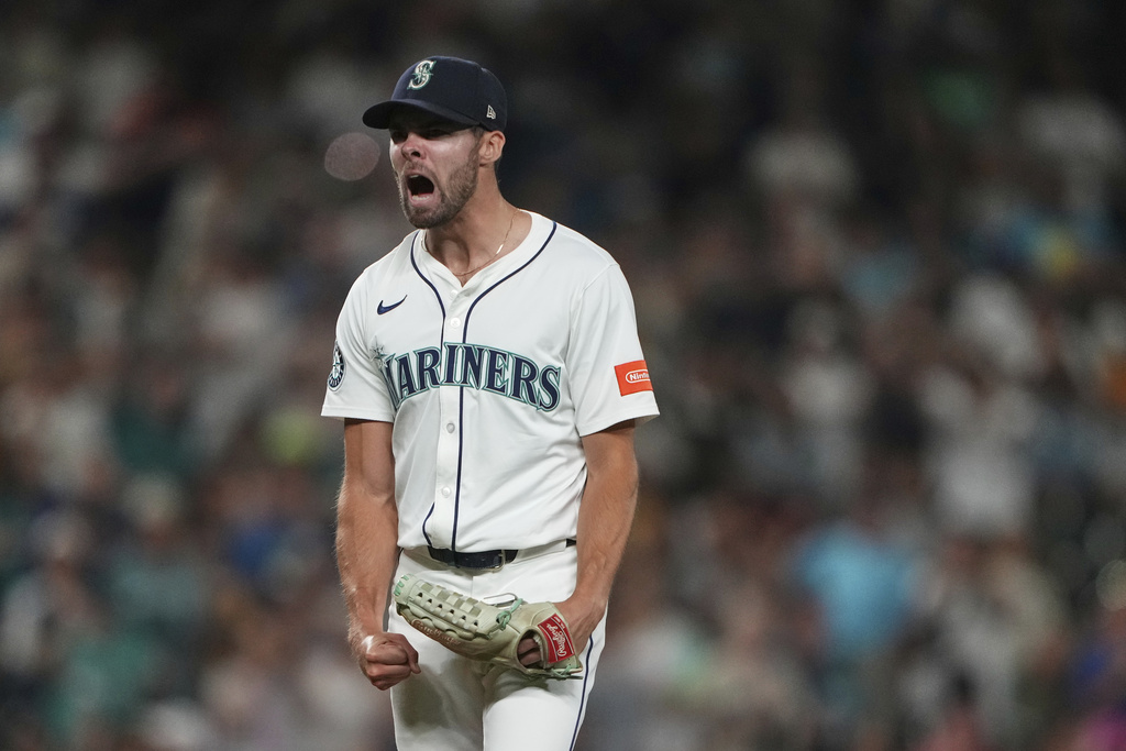 Seattle Mariners relief pitcher Matt Brash reacts to San Diego Padres' Ramon Laureano being called out on strikes with the bases loaded during the eighth inning of a baseball game Monday, Aug. 25, 2025, in Seattle. (AP Photo/Lindsey Wasson)