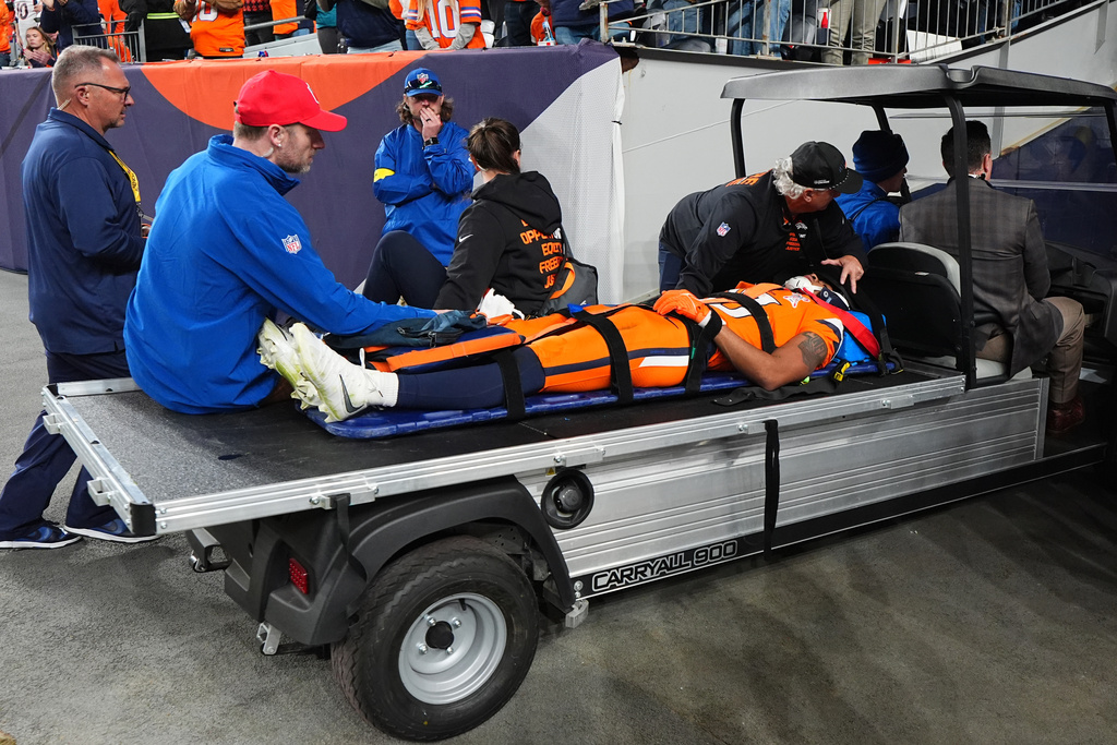 Denver Broncos wide receiver Pat Bryant is carted off the field after an injury during the second half of an NFL football game against the Jacksonville Jaguars in Denver, Sunday, Dec. 21, 2025. (AP Photo/Jack Dempsey)