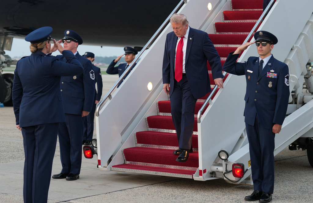 President Donald Trump exits Air Force One at Joint Base Andrews, Md., after attending the World Cup final soccer match, Sunday, July 19, 2026. (AP Photo/Jacquelyn Martin)
