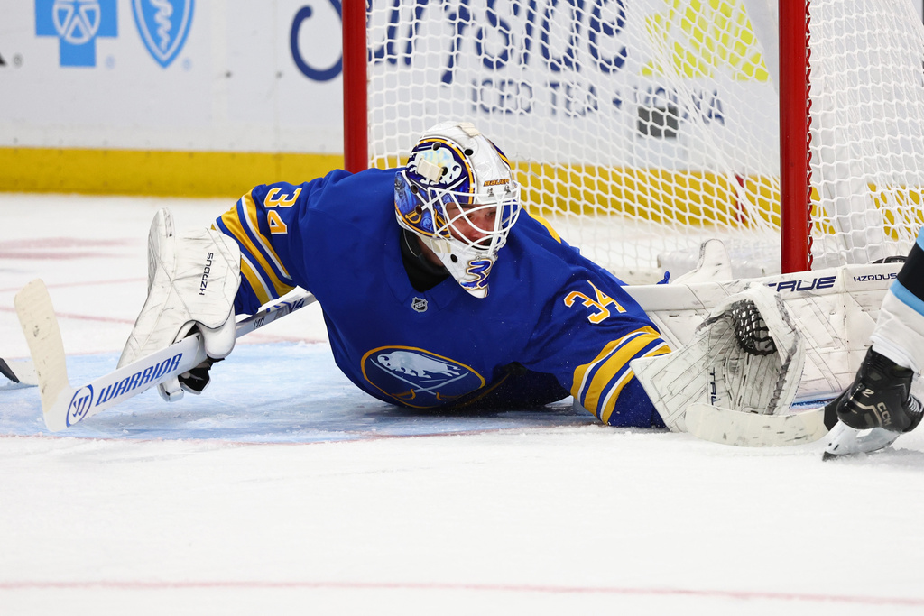 Buffalo Sabres goaltender Alex Lyon (34) makes a glove save during the second period of an NHL hockey game against the Utah Mammoth Tuesday, Nov. 4, 2025, in Buffalo, N.Y. (AP Photo/Jeffrey T. Barnes)
