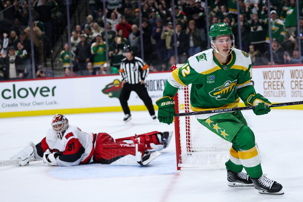 Minnesota Wild left wing Matt Boldy (12) reacts to his shootout goal against the Carolina Hurricanes during an NHL hockey game Wednesday, Nov. 19, 2025, in St. Paul, Minn. (AP Photo/Matt Krohn)