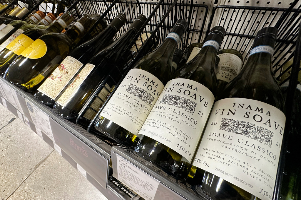 FILE - Italian bottles of white wines are dispalyed at a liquor store in Niles, Ill., Thursday, March 13, 2025. (AP Photo/Nam Y. Huh, File)