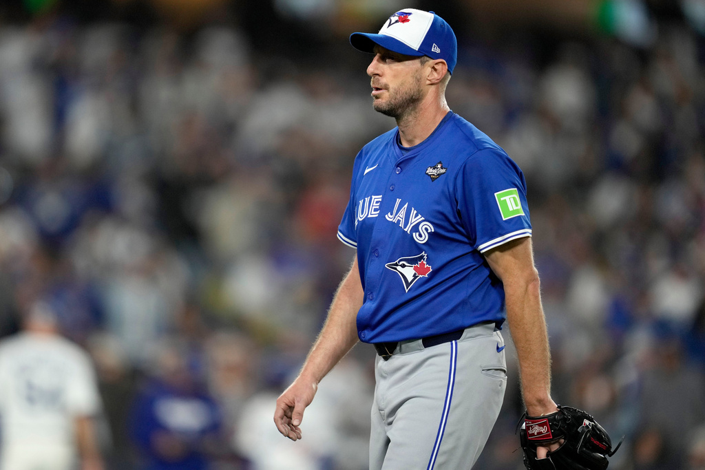 Toronto Blue Jays pitcher Max Scherzer leaves the game during the fifth inning in Game 3 of baseball's World Series against the Los Angeles Dodgers, Monday, Oct. 27, 2025, in Los Angeles. (AP Photo/Ashley Landis)