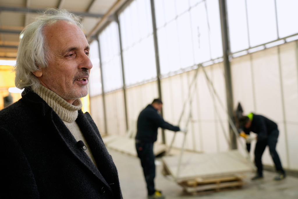 Fabrizio Mariotti is interviewed by The Associated Press at the Mariotti Carlo SpA stonecutting firm in Tivoli, Italy, on Friday, Feb. 13, 2026, as workers stack pieces of travertine that will be used to adorn the tower of the new Manhattan temple in New York City. (AP Photo/Gregorio Borgia)