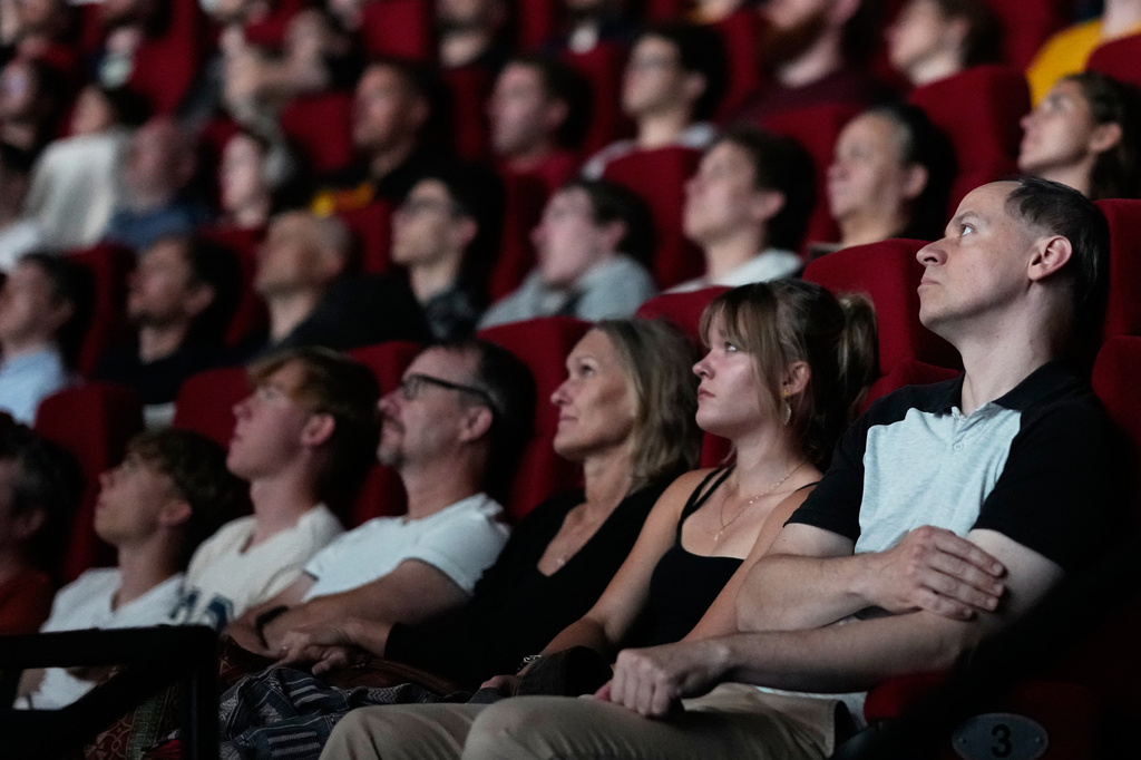 Spectators view the 70 mm Imax copy of Christopher Nolan's "The Odyssey" in Prague, Czech Republic, Monday, July 27, 2026. (AP Photo/Petr David Josek)