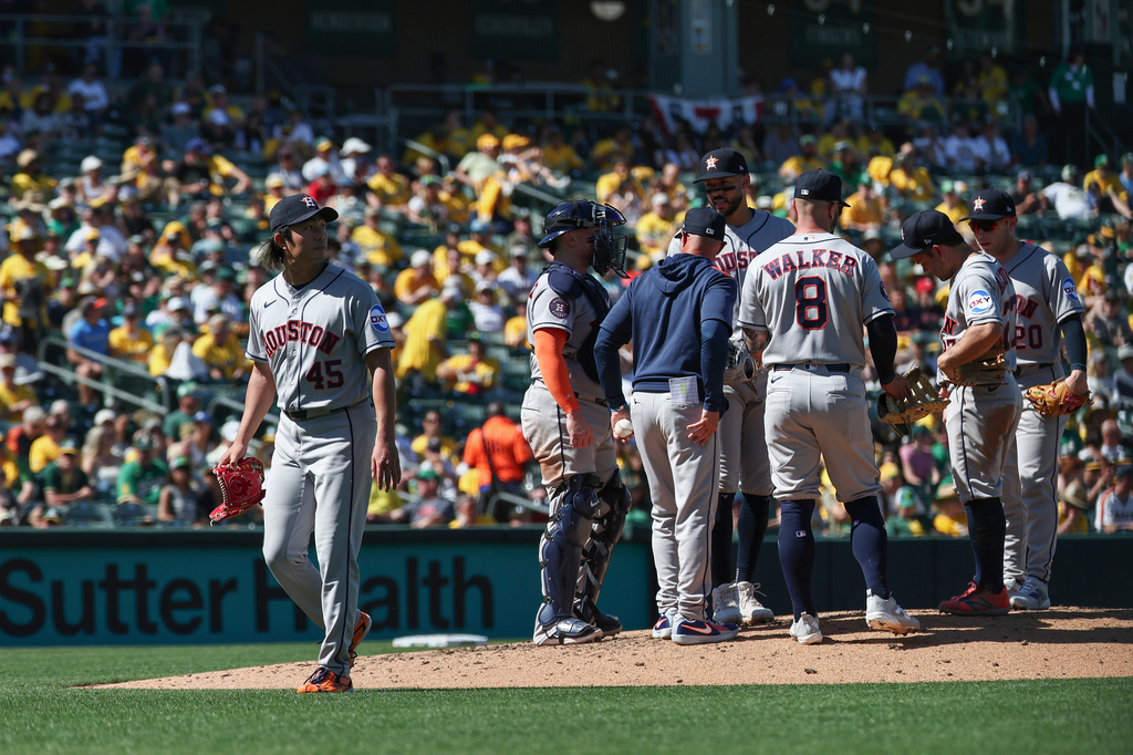 Houston Astros pitcher Tatsuya Imai, left, leaves the mound as he is relieved by pitcher Kai-Wei Teng (not shown) during the sixth inning of a baseball game against the Athletics, Saturday, April 4, 2026, in West Sacramento, Calif. (AP Photo/Sara Nevis)