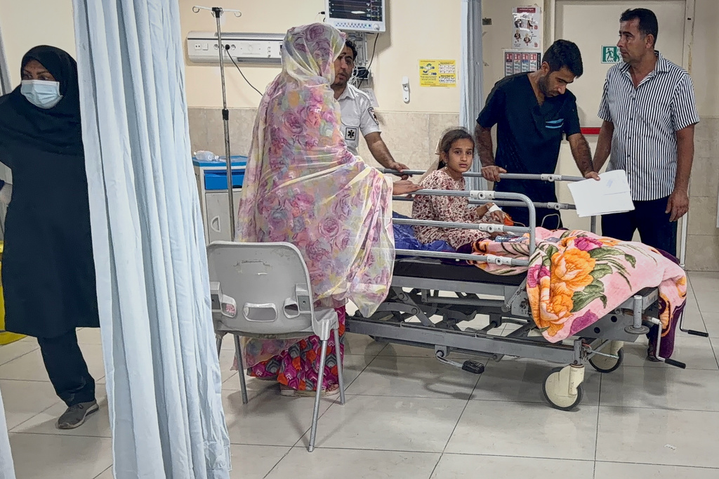 A child wounded, according to Iranian media, in a strike that hit a home where a wedding was being held in Kuhestak, southern Iran, receives treatment at a hospital in Minab, Iran, early Wednesday, Sept. 2, 2026. (Morteza Akhoondi/Tasnim News Agency via AP)
