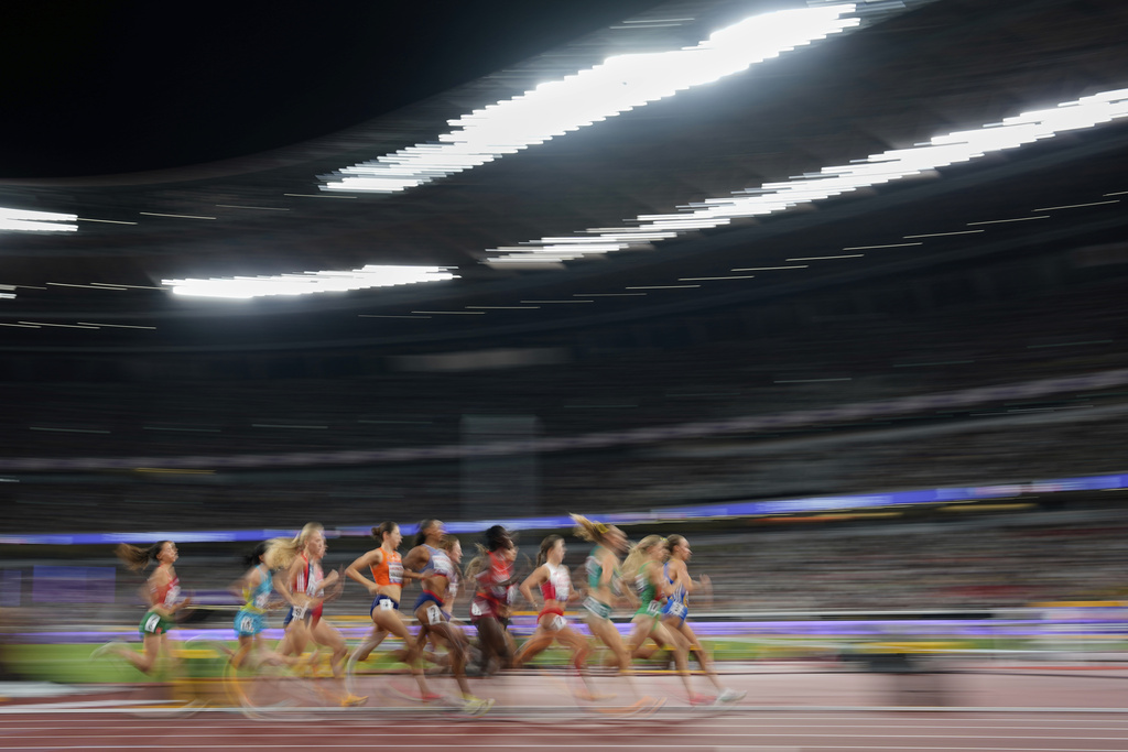 Athletes race in a women's 1,500 meters heat at the World Athletics Championships in Tokyo, Saturday, Sept. 13, 2025. (AP Photo/Petr David Josek)