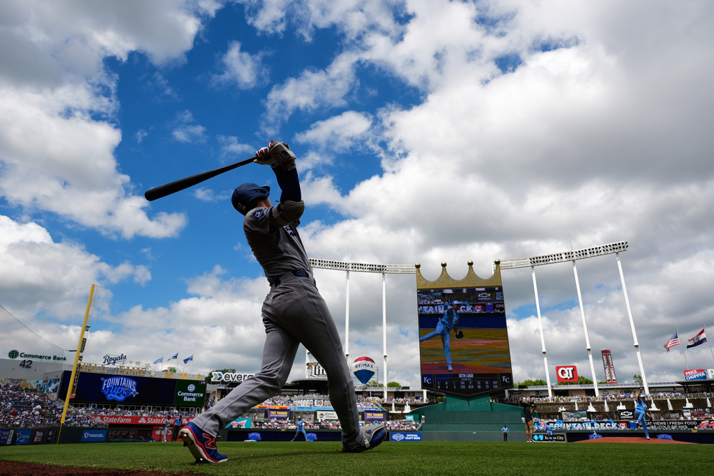 FILE - Los Angeles Dodgers' Shohei Ohtani warms up on deck before a baseball game against the Kansas City Royals, Saturday, June 28, 2025, in Kansas City, Mo. (AP Photo/Charlie Riedel, File)