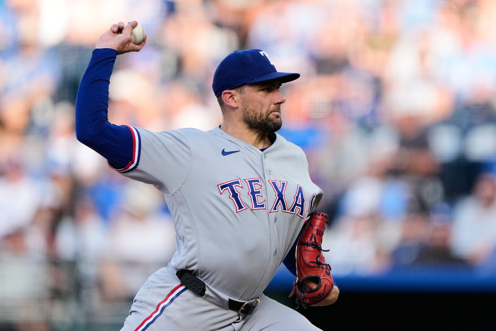 Texas Rangers starting pitcher Nathan Eovaldi throws during the first inning of a baseball game against the Kansas City Royals, Tuesday, June 9, 2026, in Kansas City, Mo. (AP Photo/Charlie Riedel)