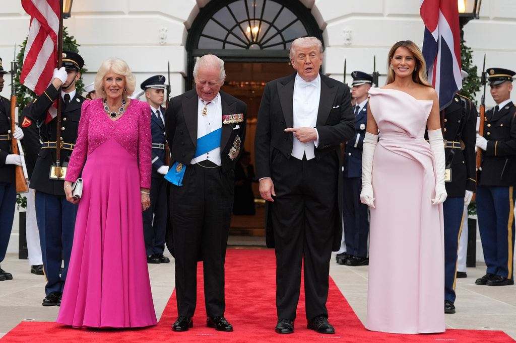 President Donald Trump and first lady Melania Trump greet Britain's King Charles III and Queen Camilla at the South Portico of the White House as they arrive for a State Dinner Tuesday, April 28, 2026, in Washington. (AP Photo/Alex Brandon)