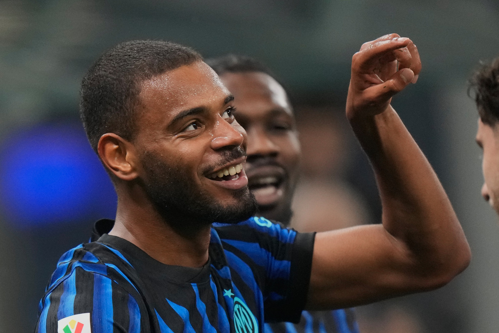 Inter Milan's Andy Diouf celebrates his side's opening goal during the Italian soccer cup round of sixteen match between Inter Milan and Venezia, at the San Siro stadium in Milan, Italy, Wednesday, Dec.3, 2025. (AP Photo/Luca Bruno)