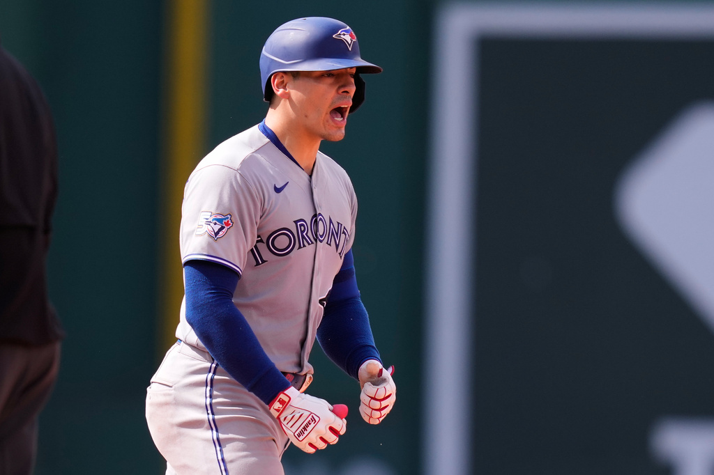 Toronto Blue Jays' Brandon Valenzuela celebrates after his RBI double, which broke a tie, during the ninth inning of a baseball game against the Boston Red Sox, Thursday, June 18, 2026, in Boston. (AP Photo/Charles Krupa)